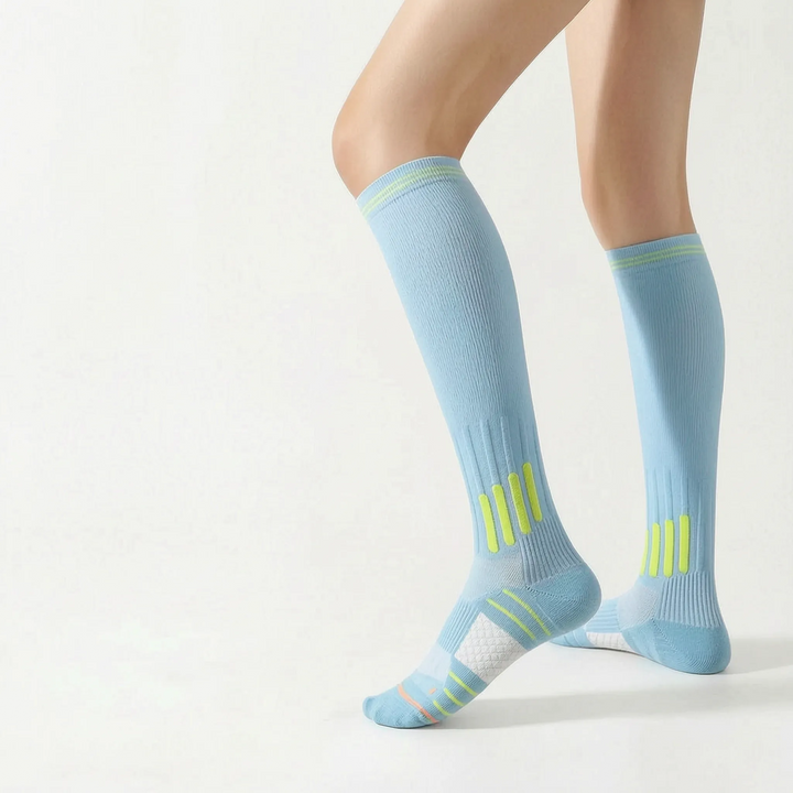 Durable white athletic socks, knee-high, providing support for sports activities.
