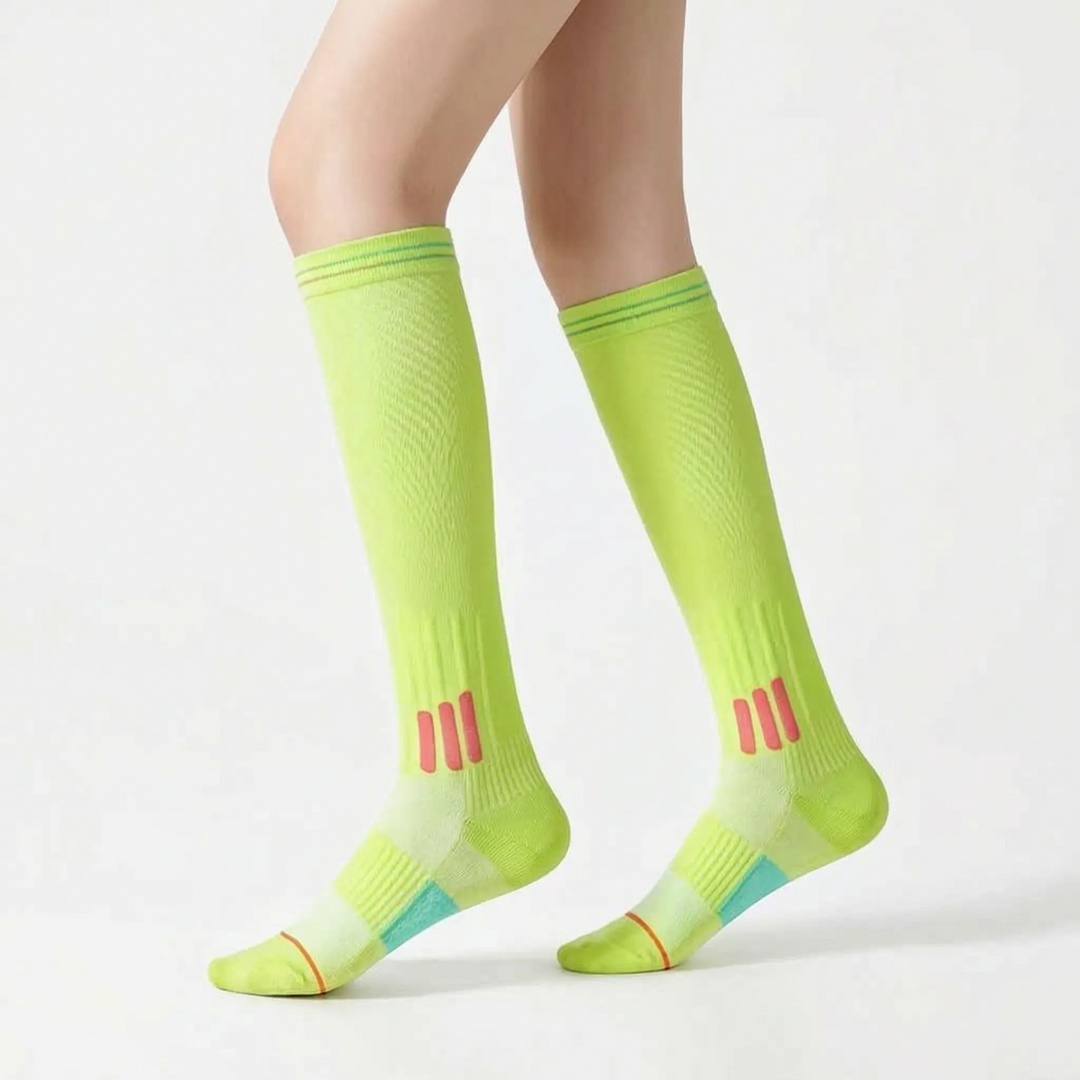 Unisex knee-high performance socks, white, engineered for athletic training.