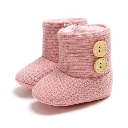 Pair of knitted baby boots with velcro closure, anti-slip sole, cozy infant footwear.