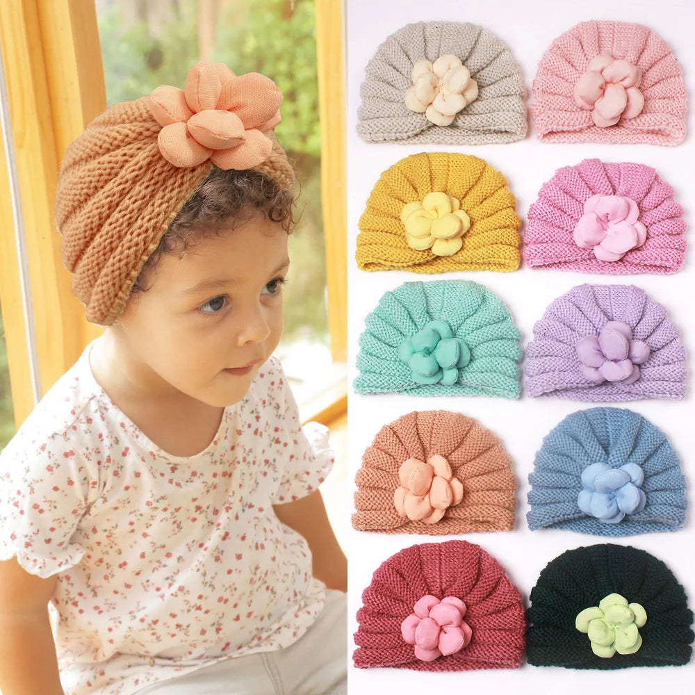 Close-up of a soft knitted candy color baby beanie, perfect warm hat for toddlers