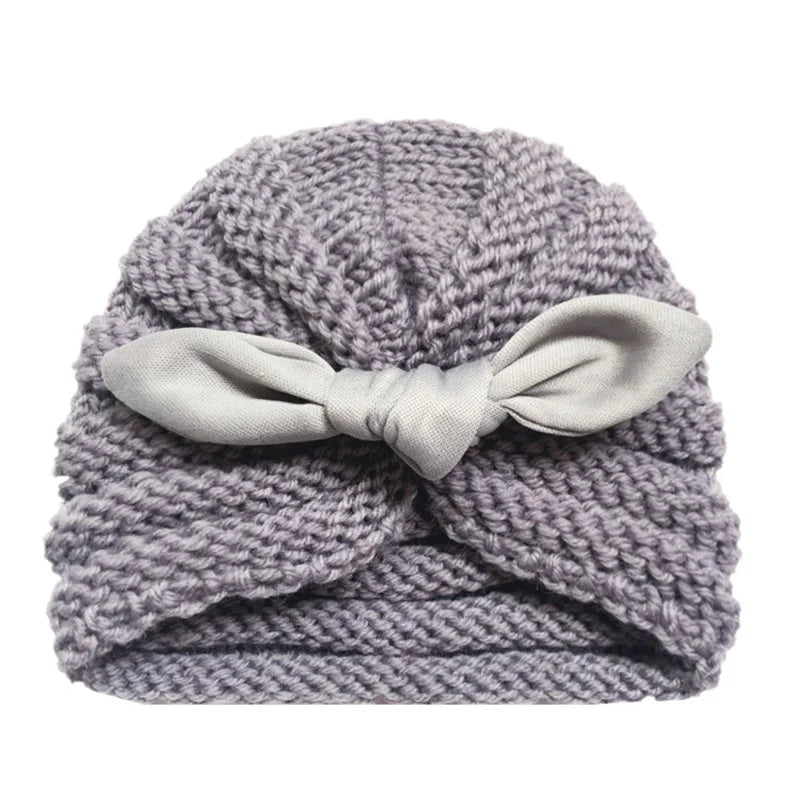 Detailed stitching of a quality knitted candy color baby hat, comfortable baby accessory