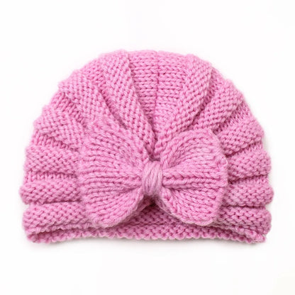 Unisex knitted baby beanie with a playful pom-pom in candy colors, warm winter infant accessory