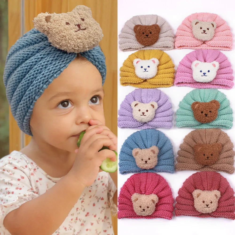 Infant wearing a cute unisex knitted baby beanie, adorable winter bonnet for babies