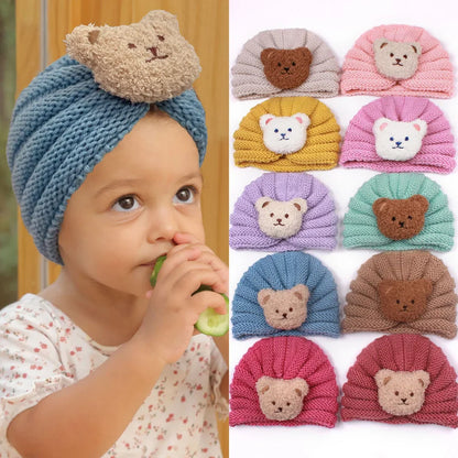 Infant wearing a cute unisex knitted baby beanie, adorable winter bonnet for babies