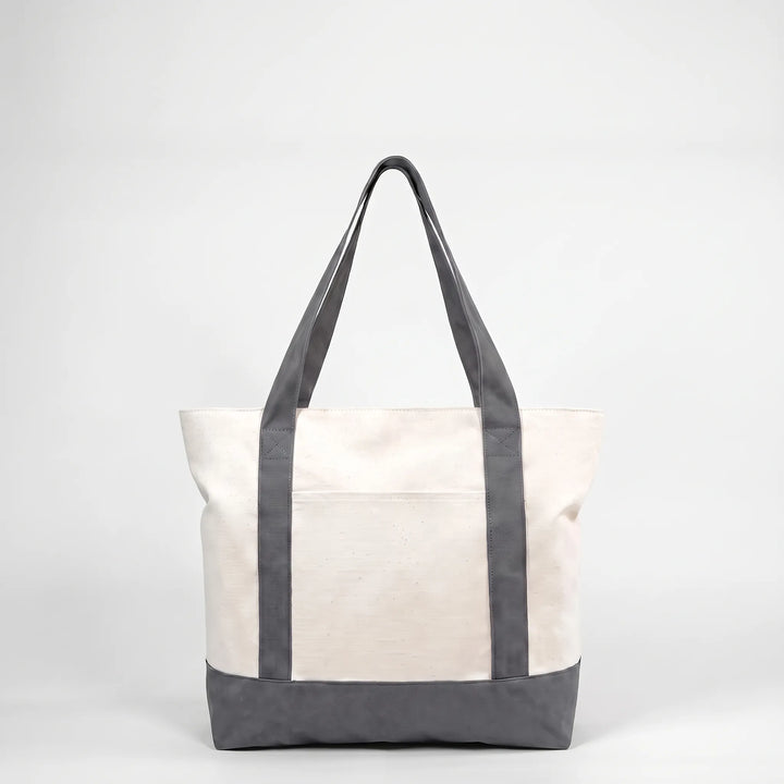 Spacious unisex zip shoulder tote, ideal for travel, gym, or groceries. Secure zipper closure.