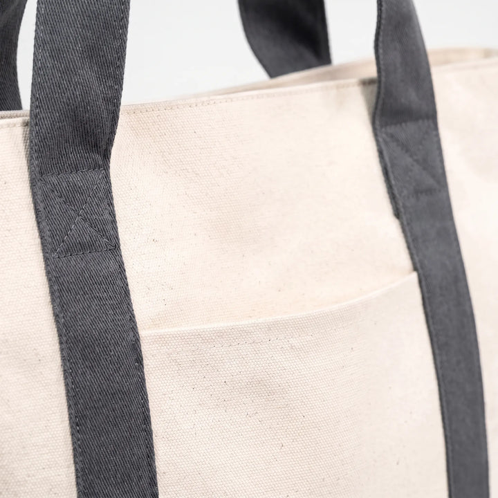 Versatile large canvas zip tote bag for men & women, great for travel, work, or beach.