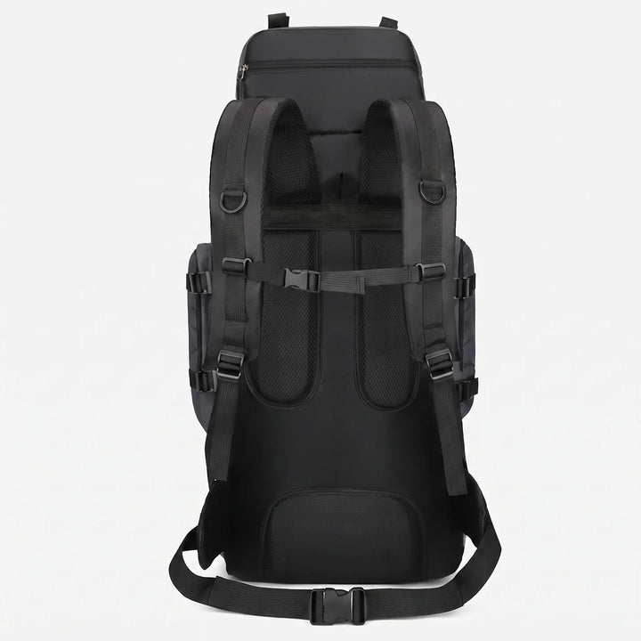 Side view of a large capacity unisex hiking backpack, highlighting strong straps & ample storage for trekking gear.