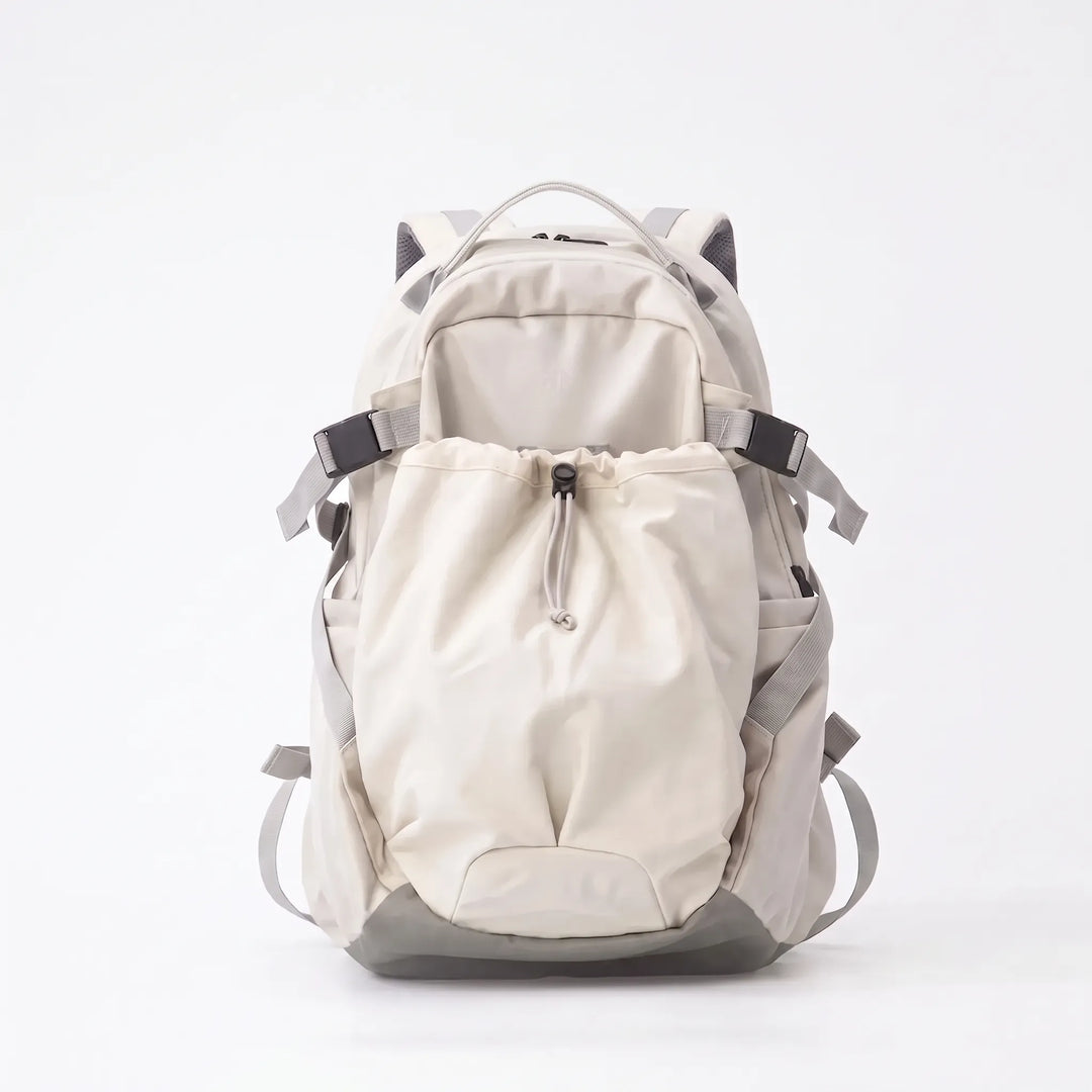 Hiker wearing a comfortable, large capacity outdoor adventure backpack on a mountain trail. Perfect for travel & camping.