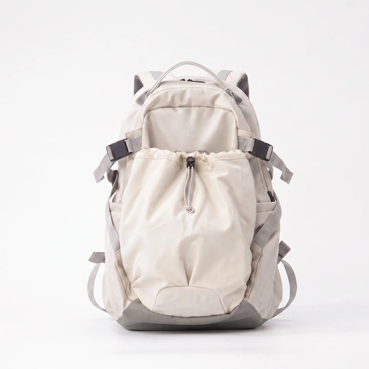 Detail of the rugged, water-resistant fabric of the large capacity hiking backpack, ensuring durability for outdoor travel.