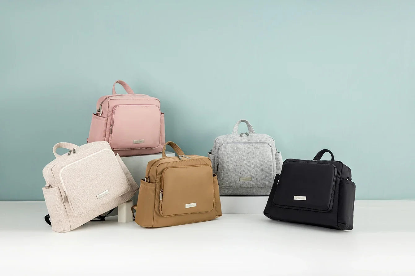 Black diaper backpack, front pocket detailed, perfect for quick access to baby pacifiers, keys