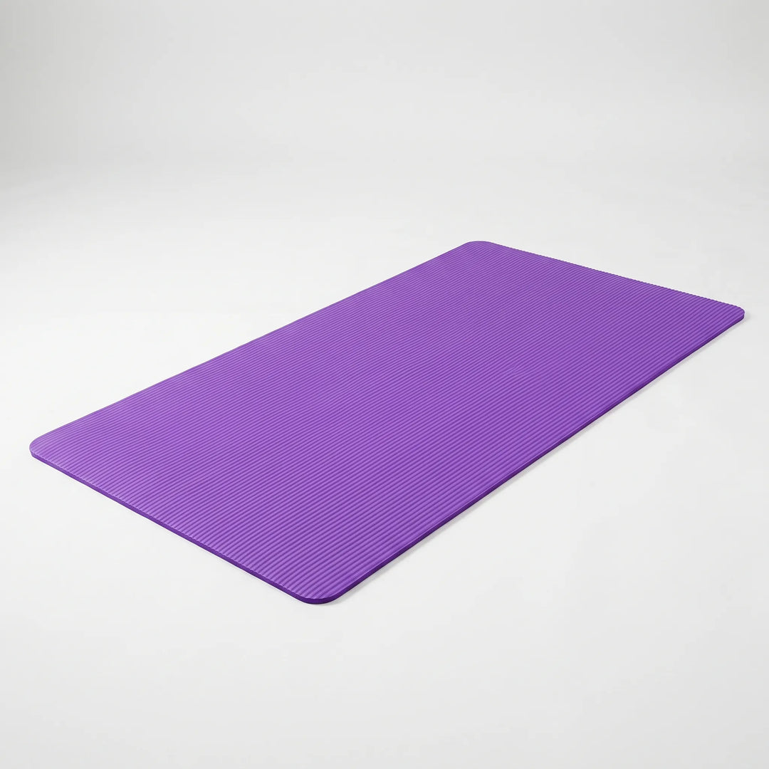 Thick, non-slip yoga and pilates mat in a neutral color. Perfect large exercise mat for home gym workouts.