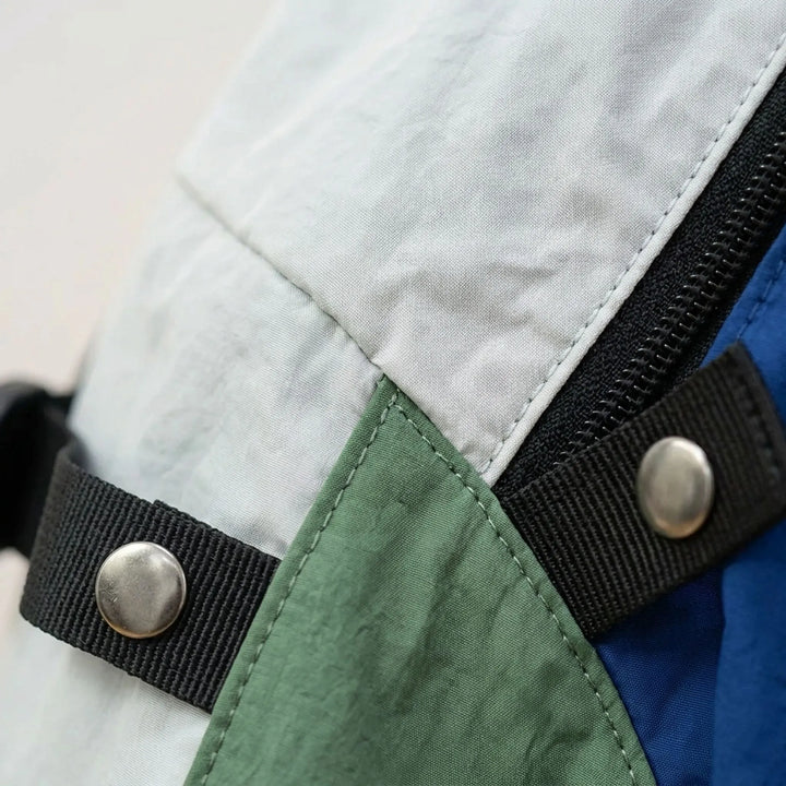 Versatile unisex day hiking backpack with padded straps & multiple pockets, ideal for trail essentials & daily use.