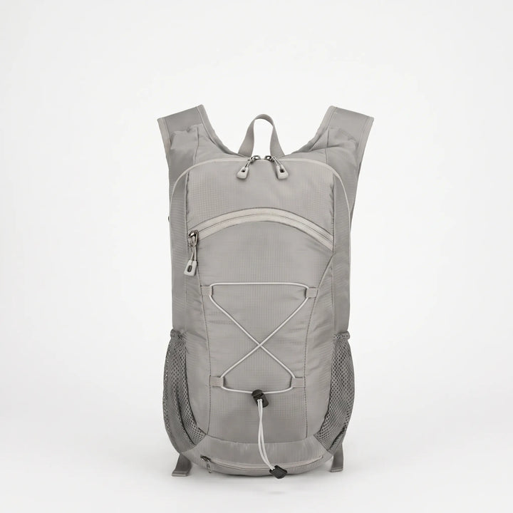 Unisex lightweight hiking backpack worn by a hiker on a scenic trail, great for day trips.