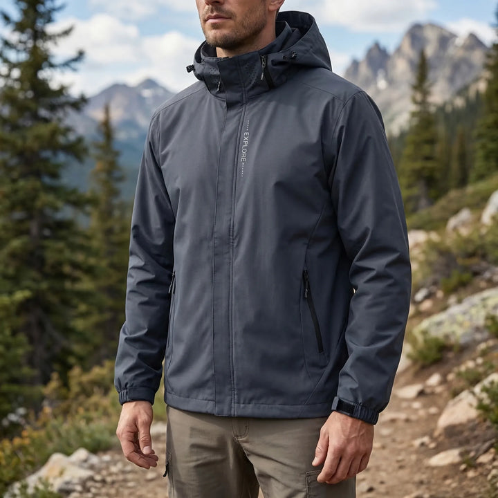 Unisex lightweight hooded rain jacket in blue, perfect for outdoor hiking & all-weather protection. Water-repellent.