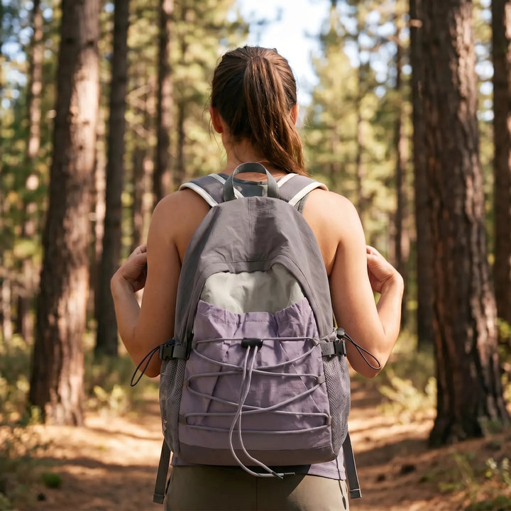 Unisex lightweight nylon daypack for outdoor travel & hiking adventures; softback design.