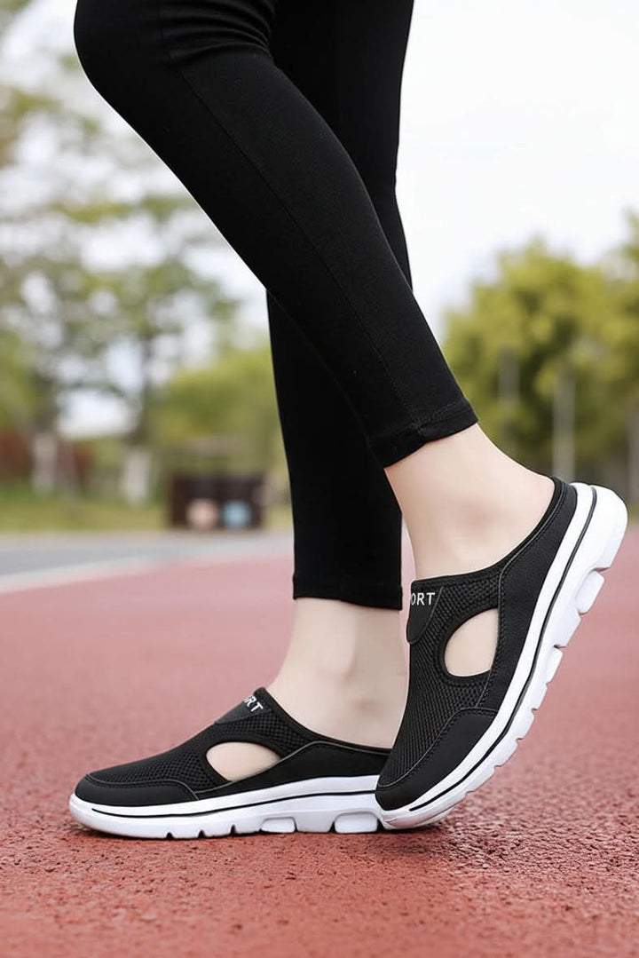 Orthopedic slip-on slippers with cushioned insole & breathable design for daily relaxation.