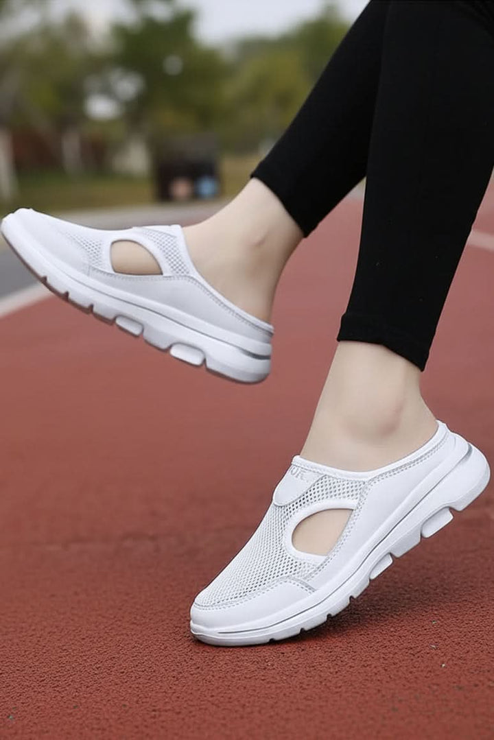Lightweight indoor slippers providing essential foot support & all-day comfort for home wear.