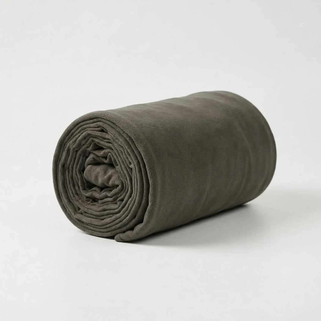 Compact roll-up fleece sleeping bag, lightweight & portable. Essential unisex gear for hiking & outdoor travel.