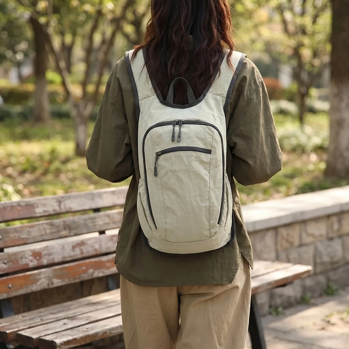 Unisex lightweight travel backpack for daily organization. Multi-compartment for casual or outdoor use.