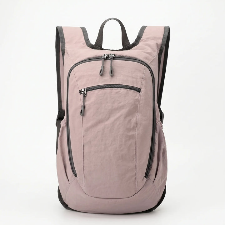 Durable lightweight hiking backpack for travel, featuring multiple compartments & comfortable design for outdoor use.