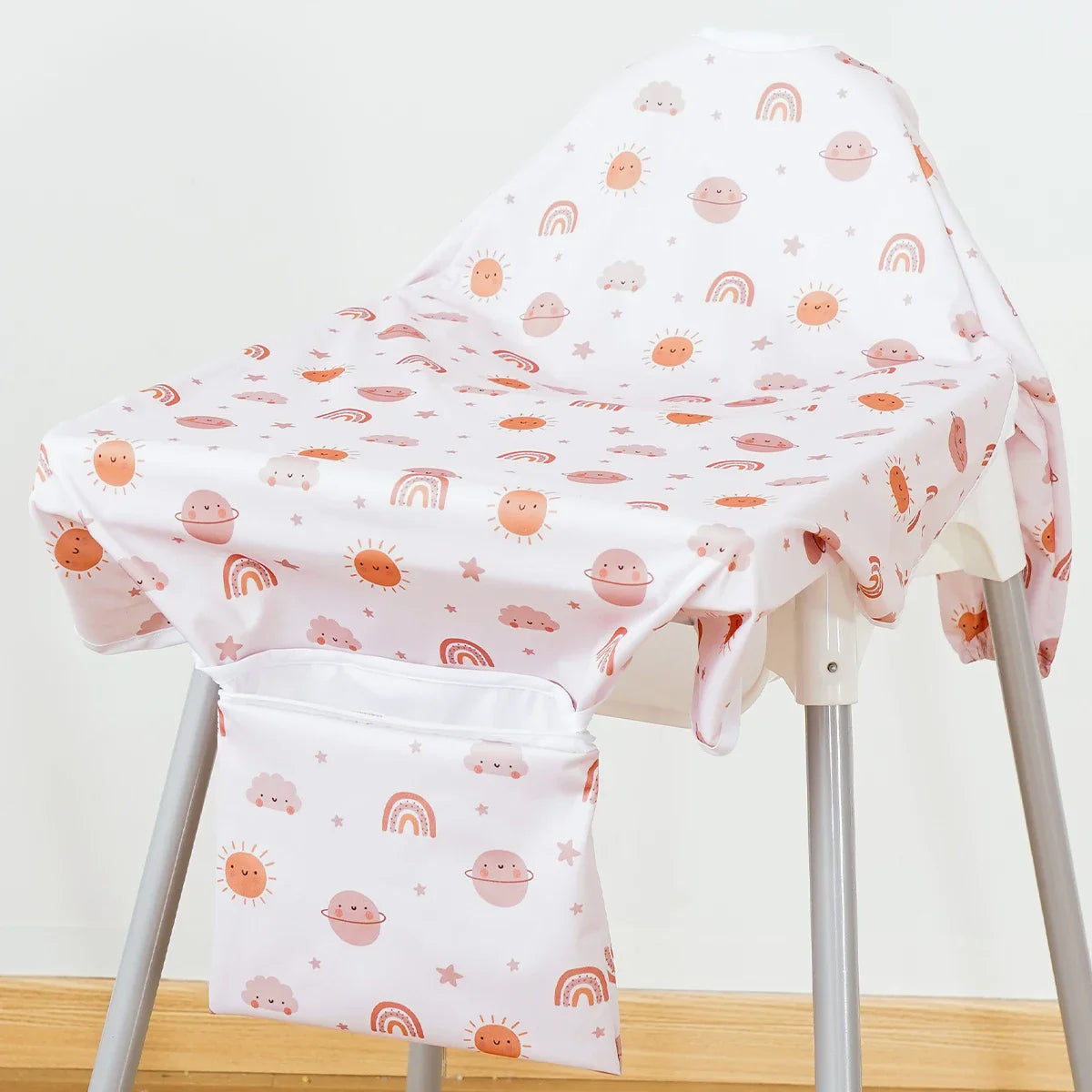 Kids long sleeve waterproof feeding bib, depicting a toddler happily eating, clothes protected.