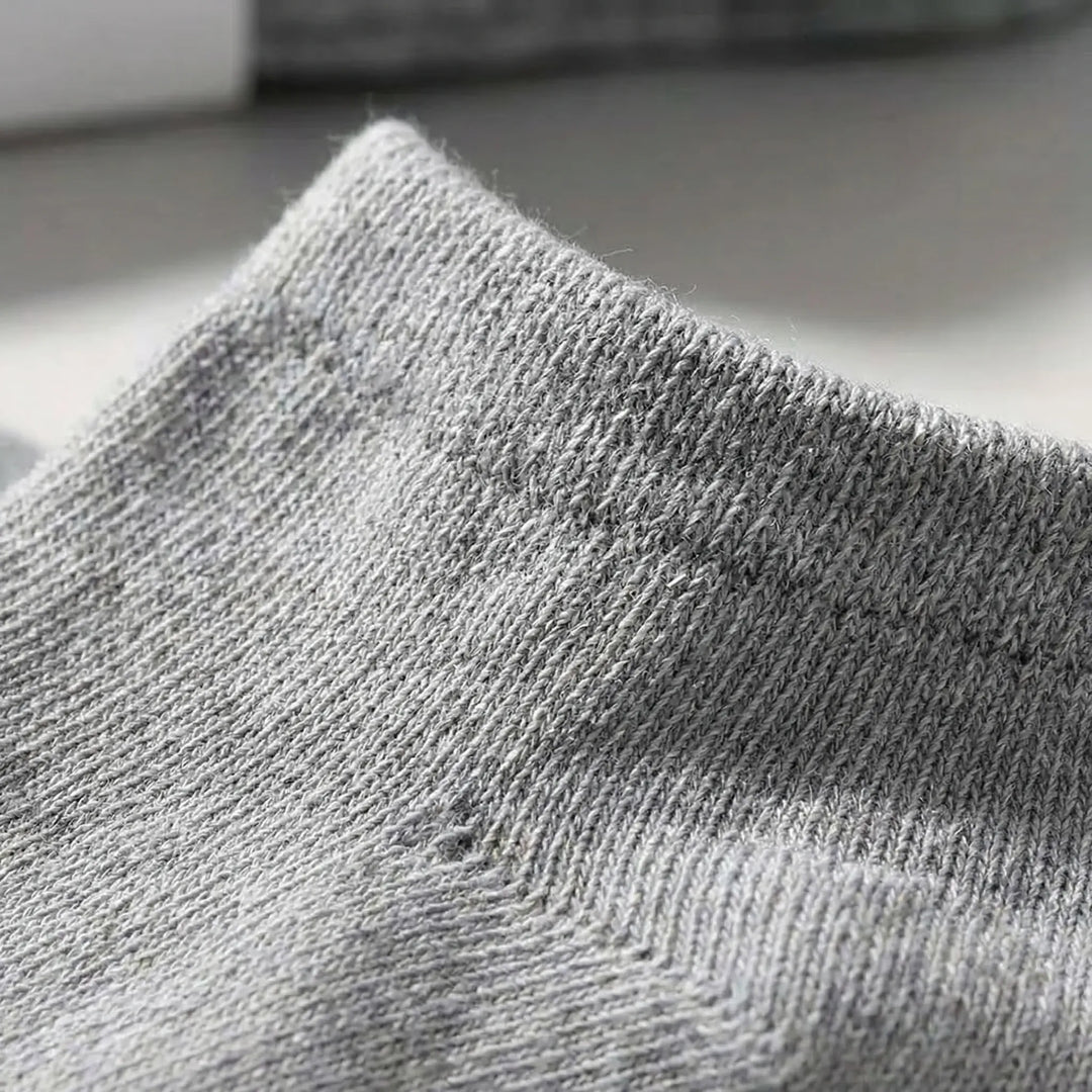 Soft black unisex low-cut ankle socks, designed for ultimate comfort & everyday wear. Bulk pack convenience.