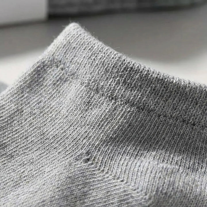 Soft black unisex low-cut ankle socks, designed for ultimate comfort & everyday wear. Bulk pack convenience.