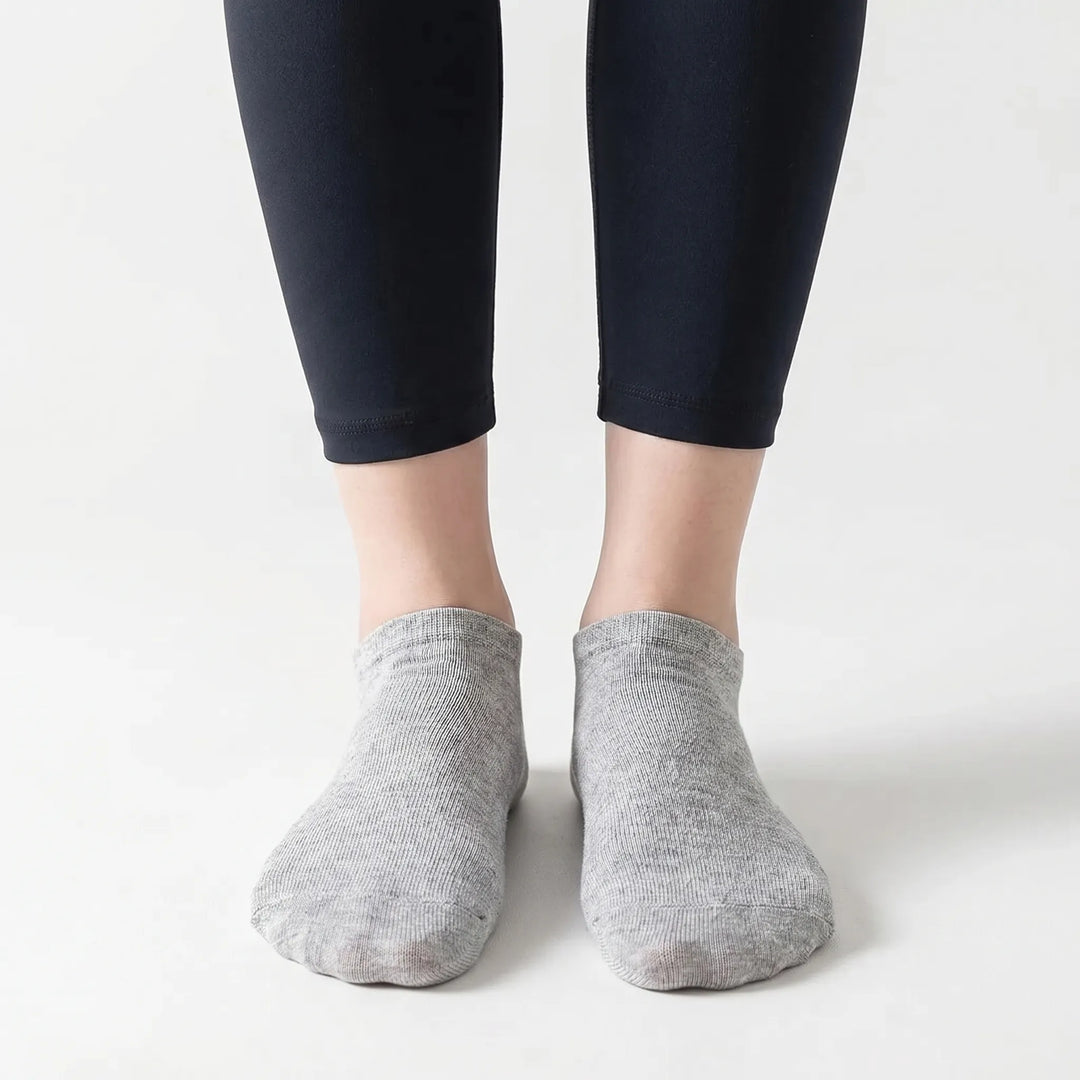 Assorted bulk pack of black, white, & gray unisex low-cut ankle socks for superior everyday comfort.