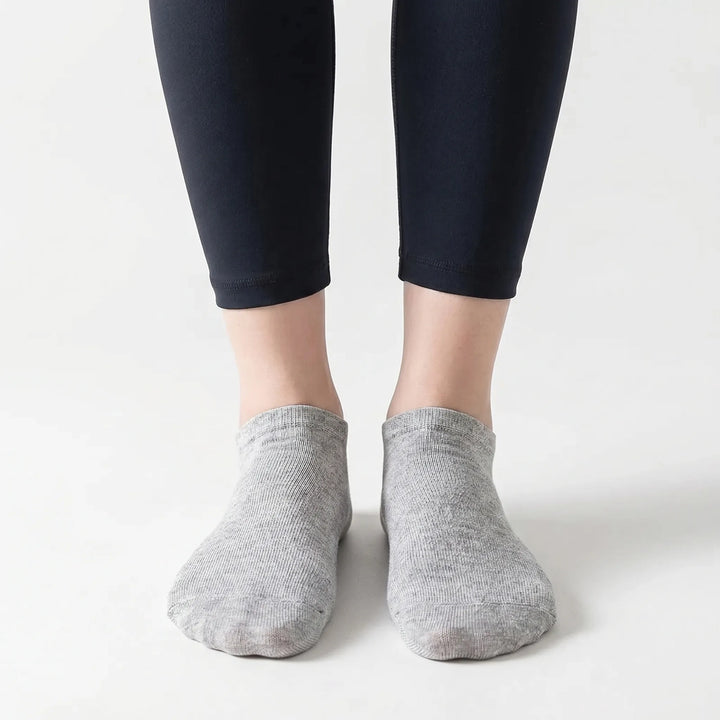 Assorted bulk pack of black, white, & gray unisex low-cut ankle socks for superior everyday comfort.