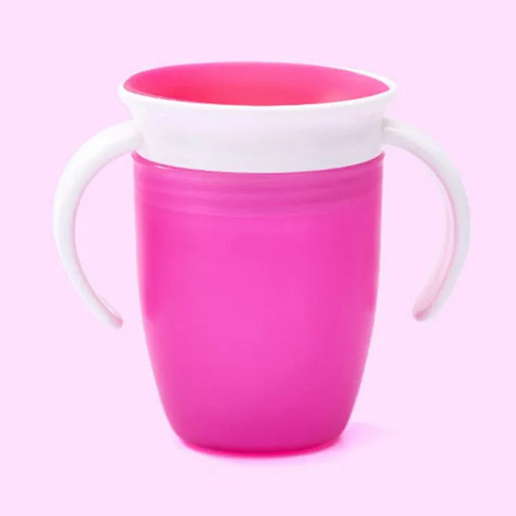 Lifestyle image of a Magic 360° Spill-Proof Sippy Cup being used by a baby at a high chair