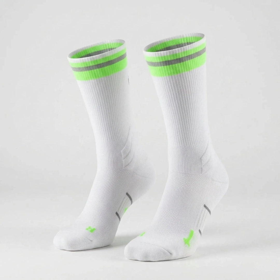 Reflective unisex mid-calf compression socks for enhanced visibility during night running and cycling workouts.