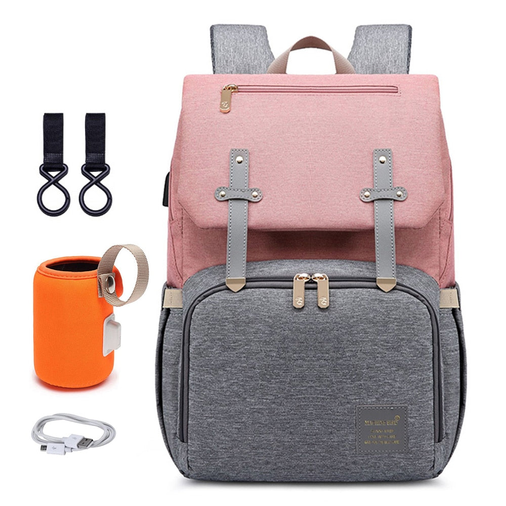 Side view of a grey unisex multi-functional diaper backpack, emphasizing its large capacity for baby supplies.