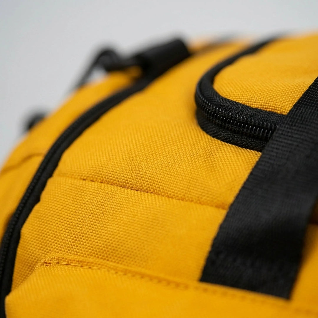 Durable oxford fabric unisex sports duffel bag with multiple pockets, functions as a gym bag or travel backpack.