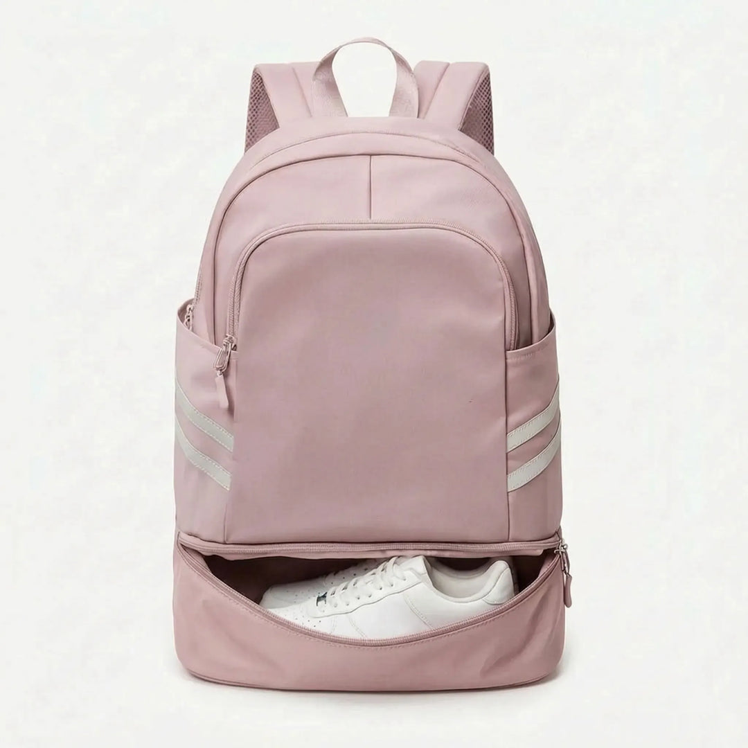 Person wearing a sleek unisex sports backpack. Multi-pocket design for gym, work, or weekend travel.