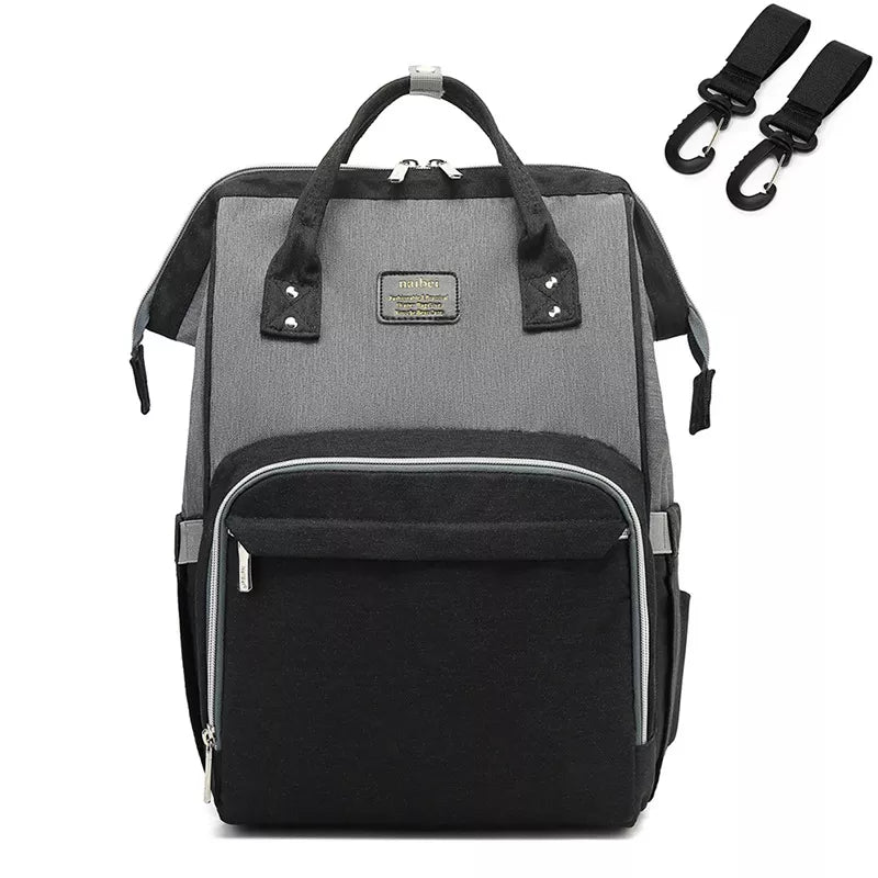 Side profile of a well-filled unisex nappy backpack, showing its capacity