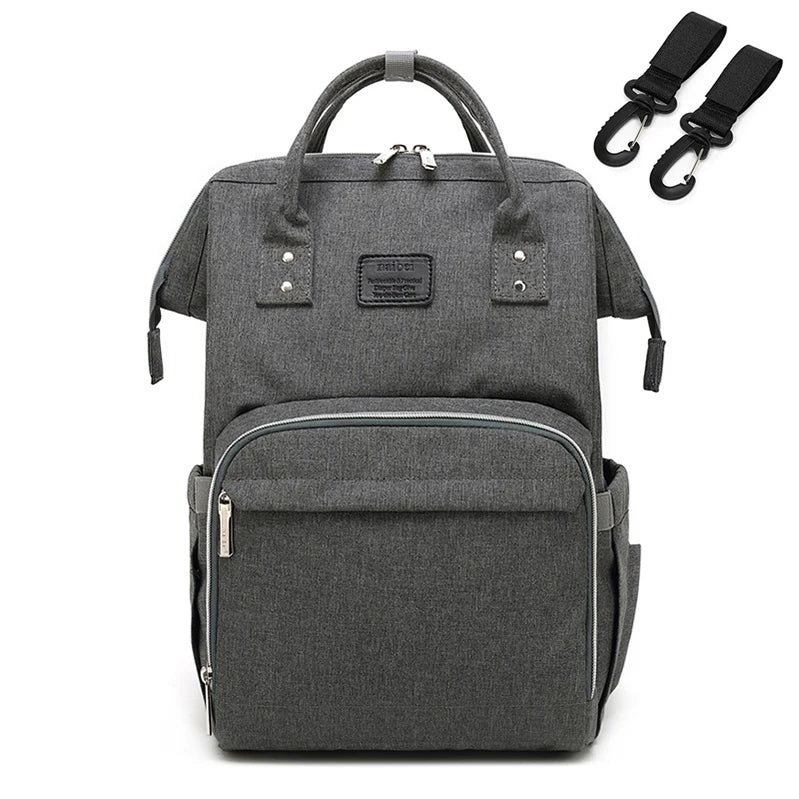 Unisex baby travel bag hanging from a stroller, easy access to essentials