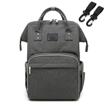 Unisex baby travel bag hanging from a stroller, easy access to essentials