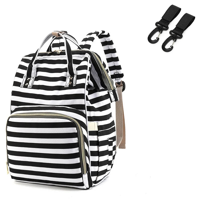 Top-down view of a spacious unisex nappy backpack, offering ample storage