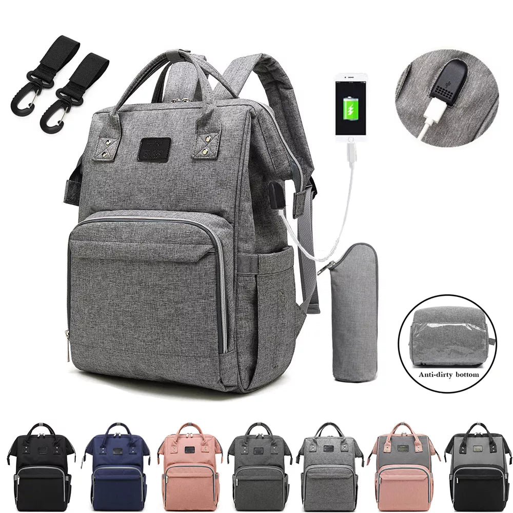 Stylish grey unisex baby nappy backpack with multiple pockets, ideal for new parents