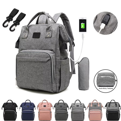 Stylish grey unisex baby nappy backpack with multiple pockets, ideal for new parents