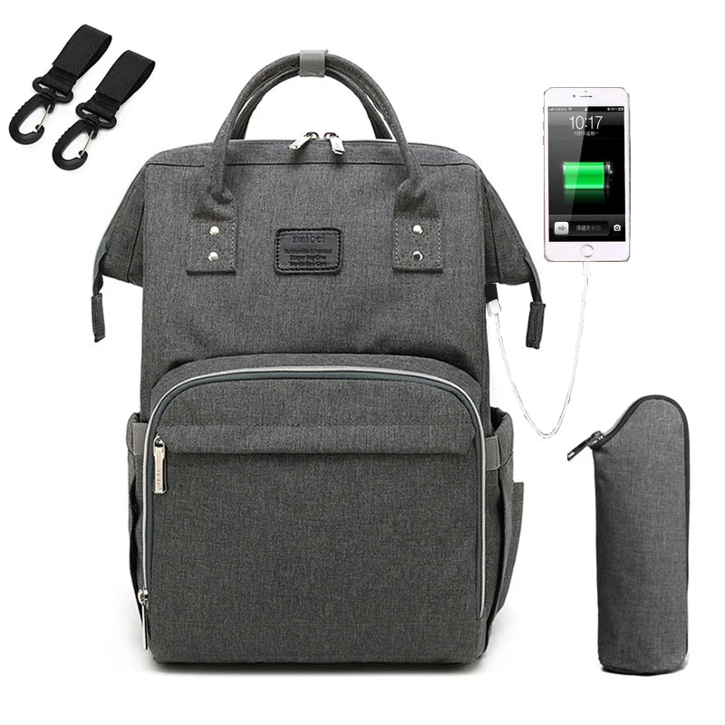 Detail of a padded back panel on a unisex multifunction nappy backpack for comfort