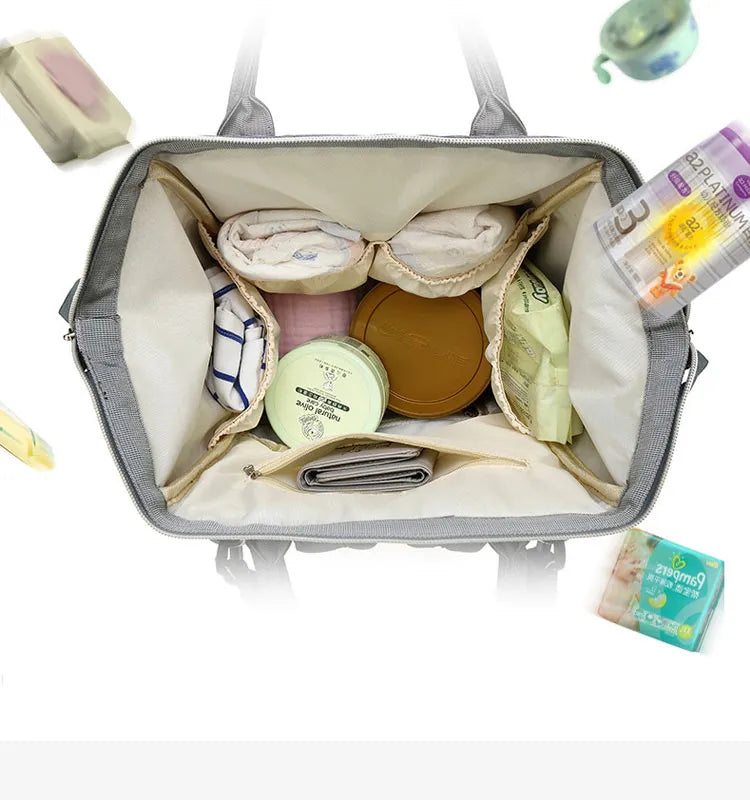 Close-up of the brand logo on a stylish unisex multifunction diaper bag