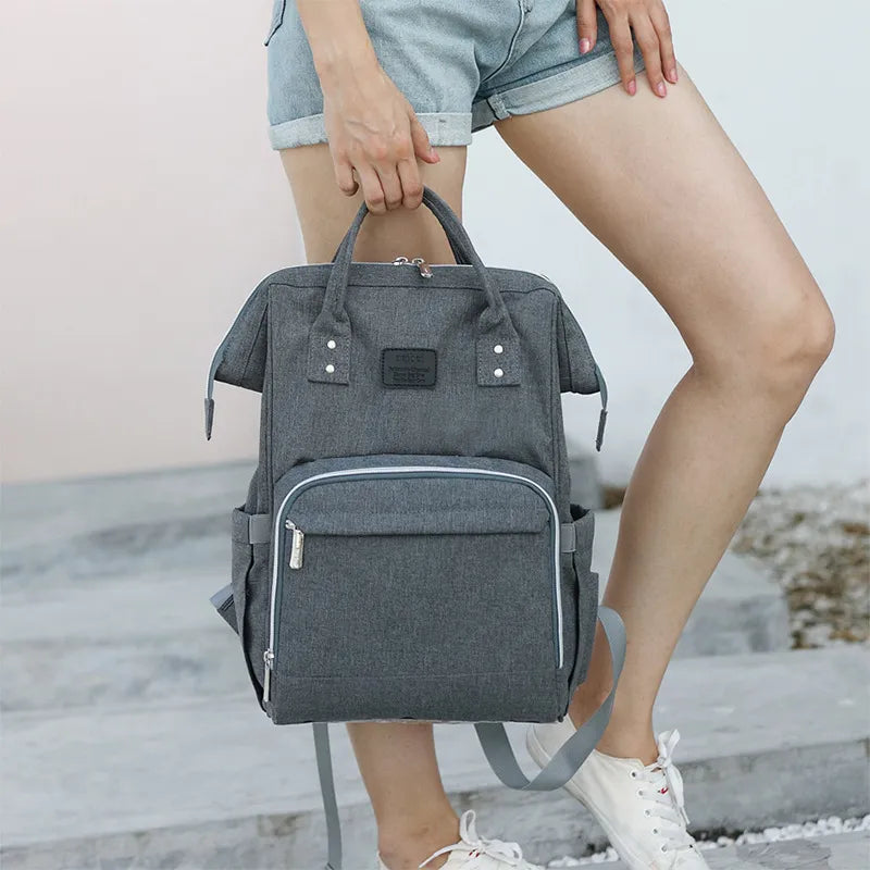 Close-up of waterproof fabric on a unisex multifunction diaper bag, durable travel accessory