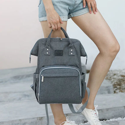 Close-up of waterproof fabric on a unisex multifunction diaper bag, durable travel accessory