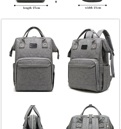 Unisex nappy backpack laid flat, showcasing its various compartments and features