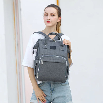 Open view of unisex nappy backpack compartments, organized storage for baby supplies