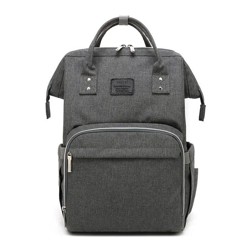 Detail of insulated side pocket on a multifunction baby nappy backpack, parenting essential