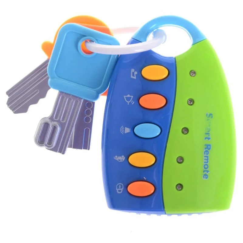 Baby’s hand reaching for the musical key and remote play set, an educational sensory toy