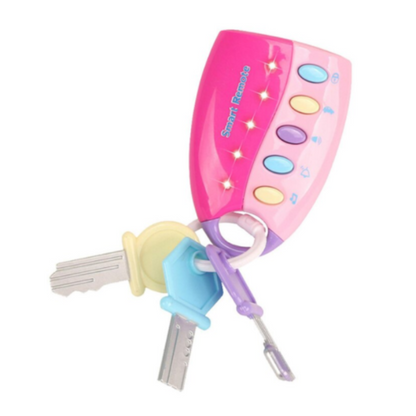 Toddler playing with a pretend musical key and remote set, a fun unisex educational toy