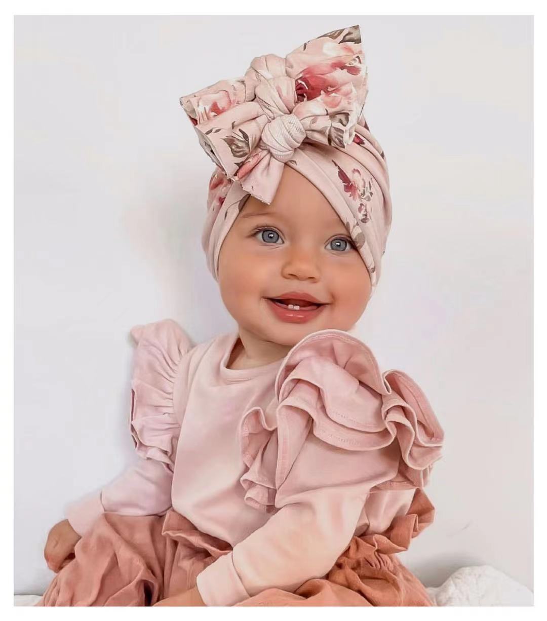 Unisex newborn baby beanie with delicate floral print, soft and stretchable for comfort